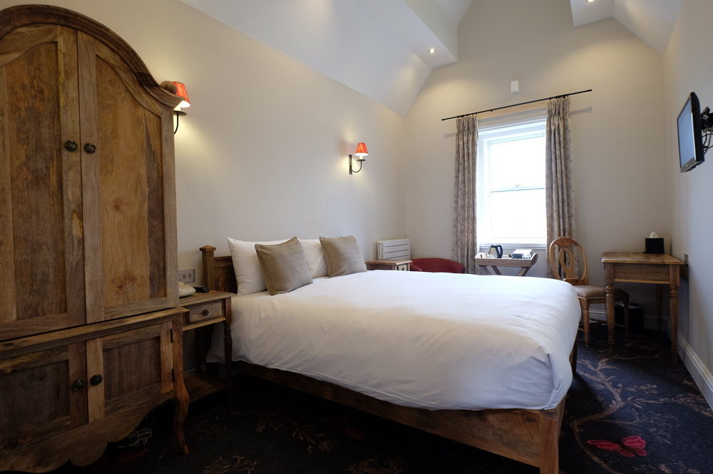 Cotswold Grange Panzió Cheltenham Kültér fotó A room at the hotel